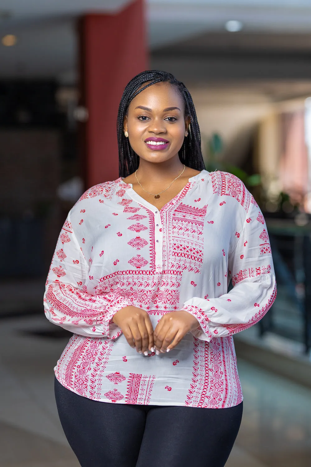 Red and white long sleeved top